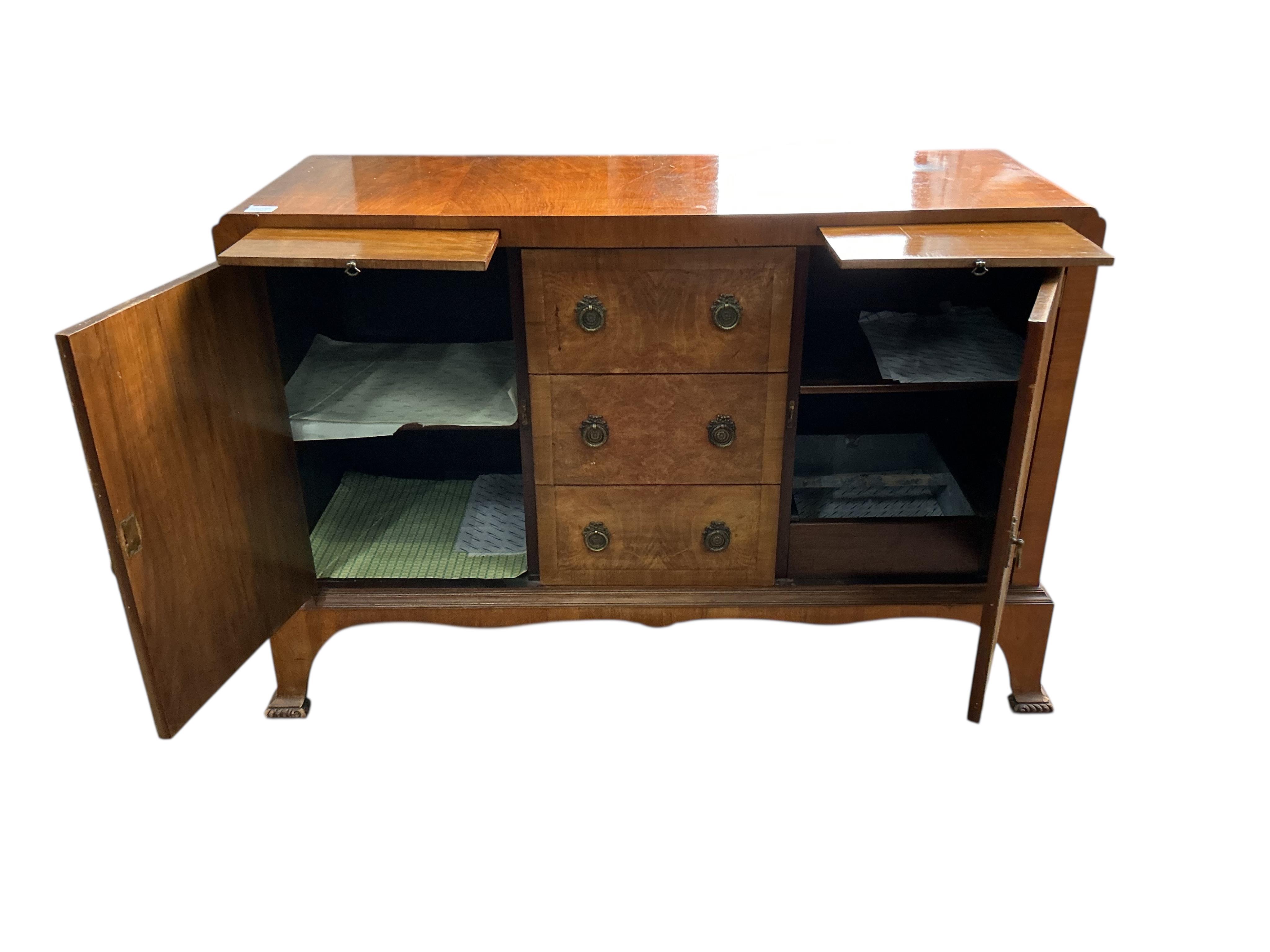 A 1930’s walnut sideboard, width 132cm, depth 46cm, height 90cm